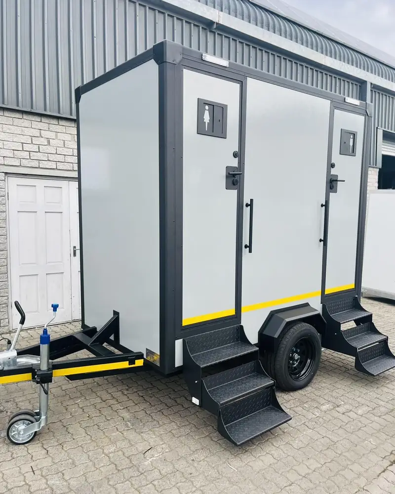 Two-door restroom trailer with steps